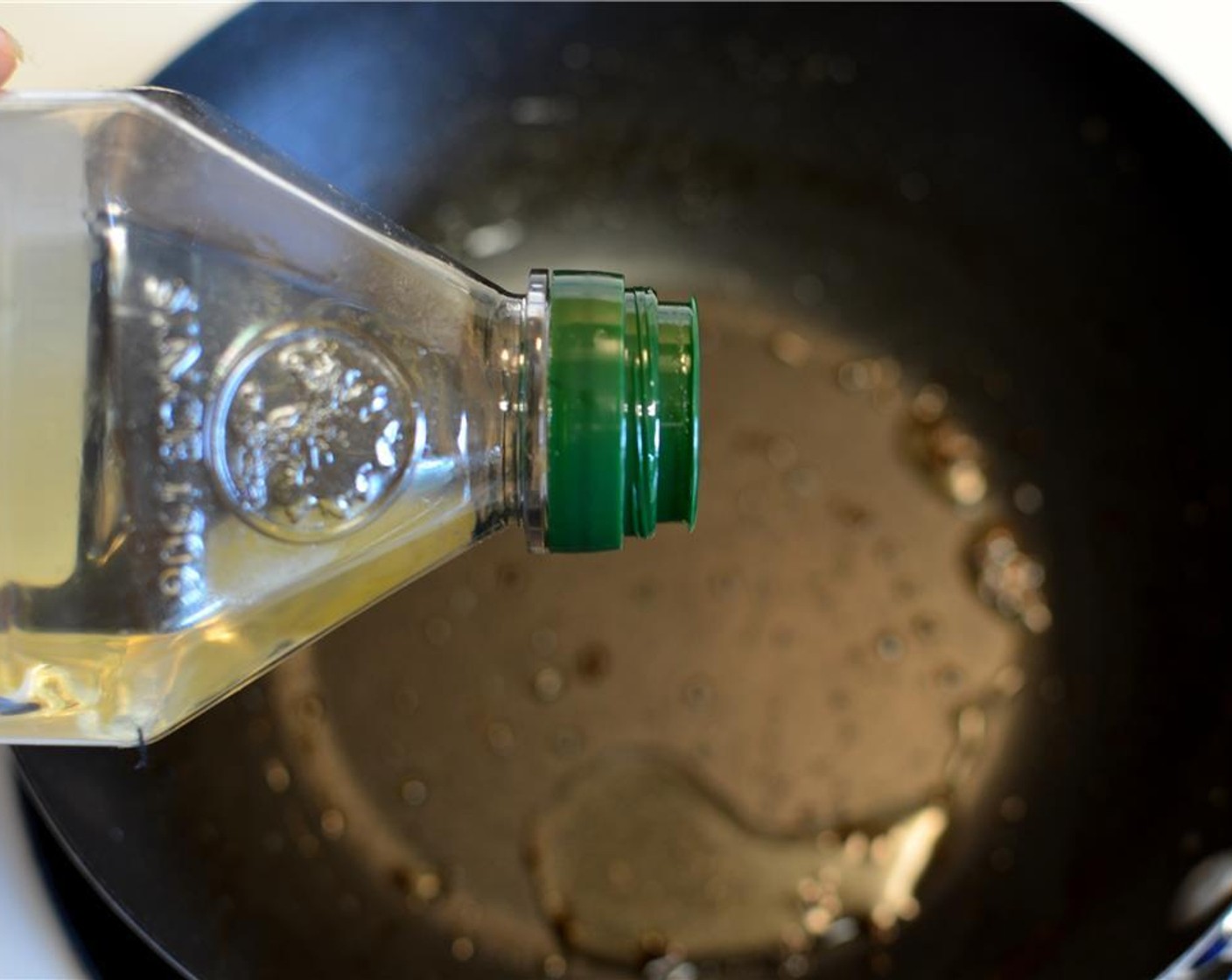 step 9 In the same pan (no need to wash it) add a touch of Olive Oil (1 Tbsp) and toss in the garlic cloves to allow them to flavor the oil for a few minutes.