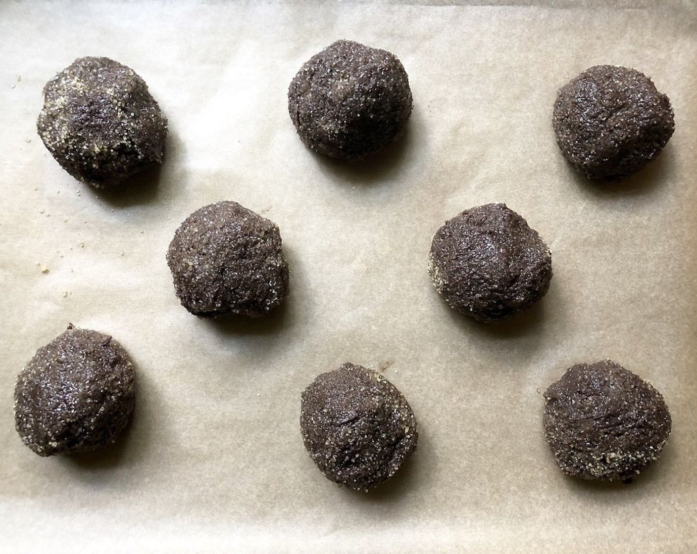 step 7 Place balls on prepared baking sheet, 2-inches apart. Bake for 15-18 minutes, until set but not hard, rotating once halfway. Let cool completely on tray or on a cooling rack.