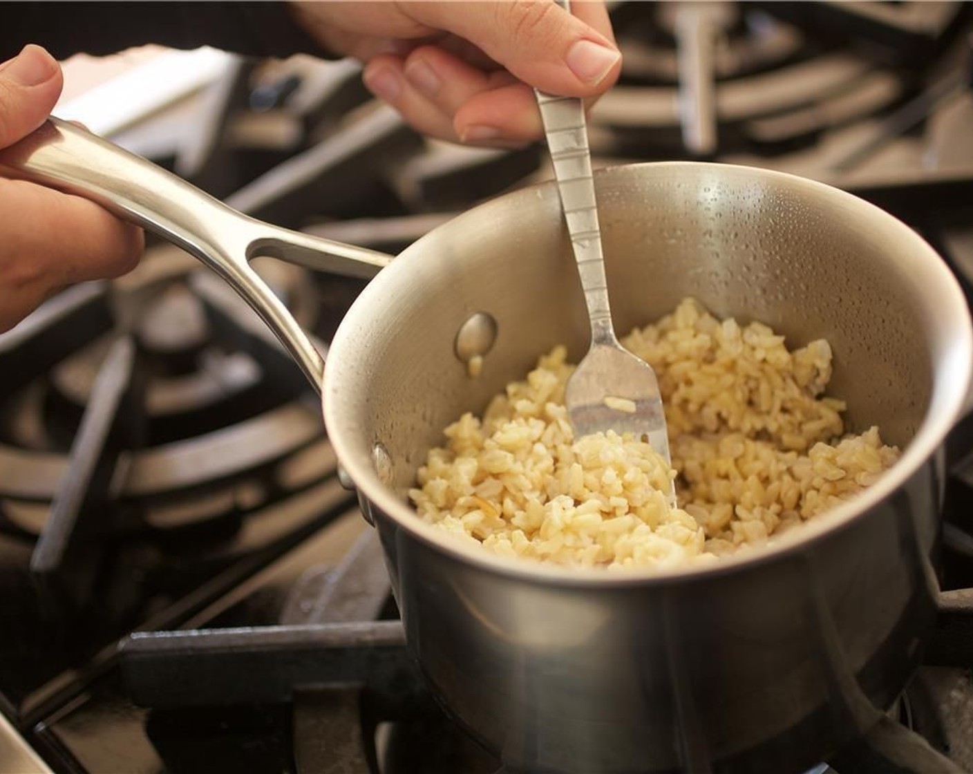 step 2 Remove from heat and fluff rice with a fork, set aside, covered, until plating.