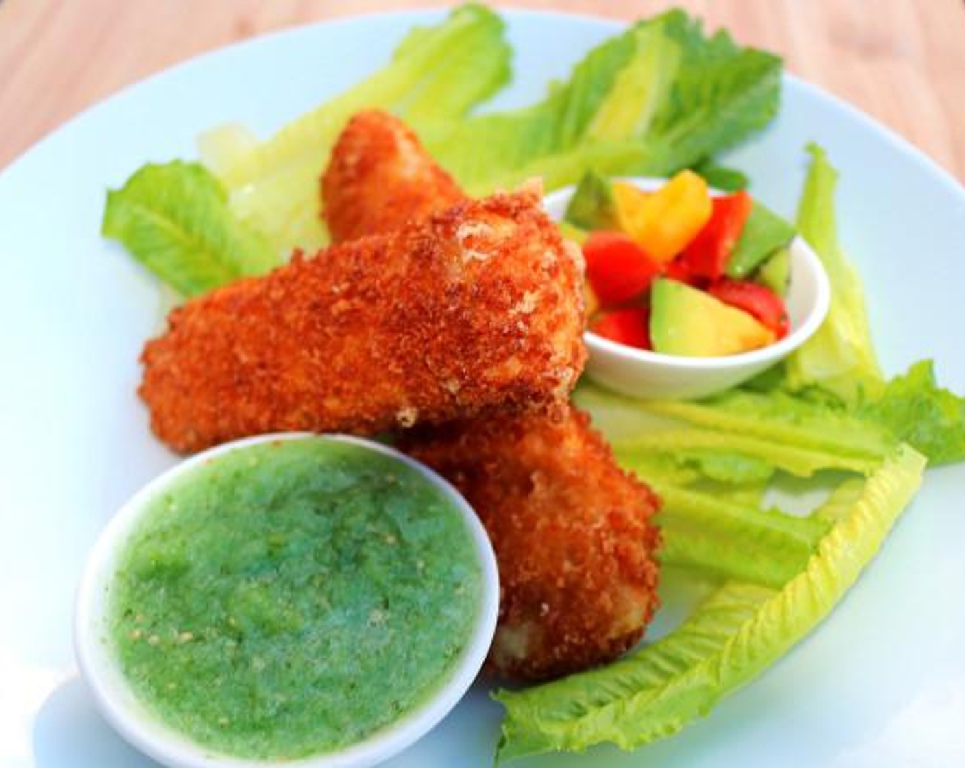 step 5 Fry the cheese at 375 degrees F (190 degrees C) until crisp and golden, serve with the salsa, avocado and vinaigrette dressed Romaine Lettuce (to taste).