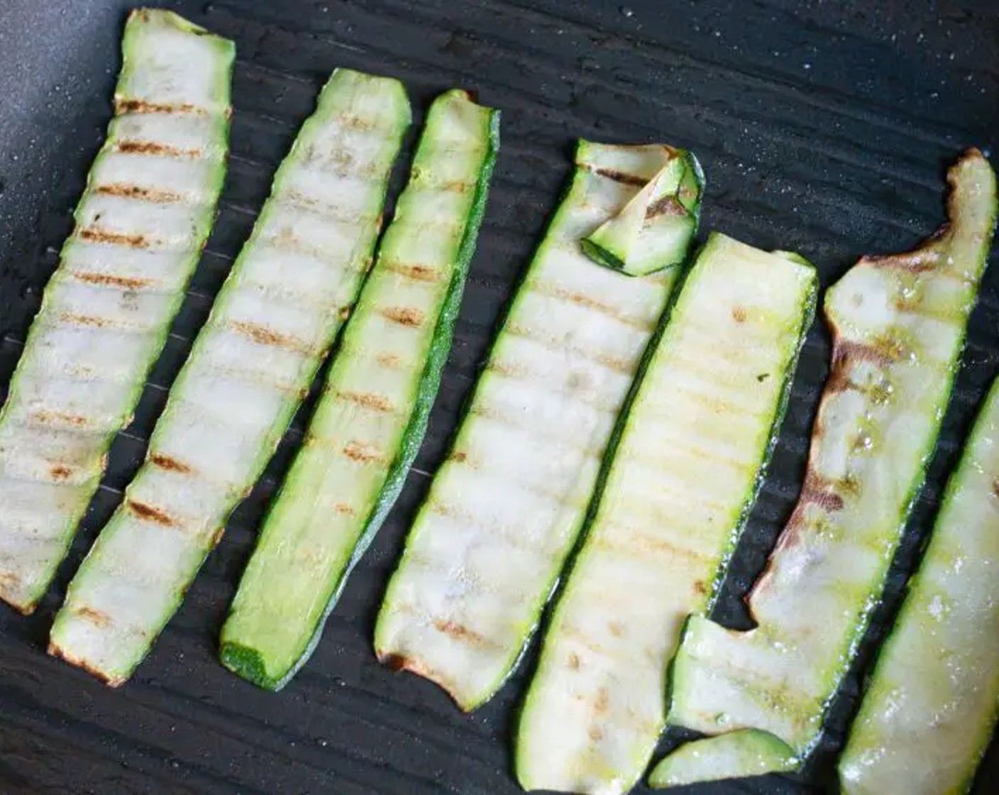 step 3 Once the pan is hot, add the courgette “ribbons” in a single layer and fry for around 15-20 seconds on each side until charred. Repeat until all the courgette “ribbons” have been cooked.