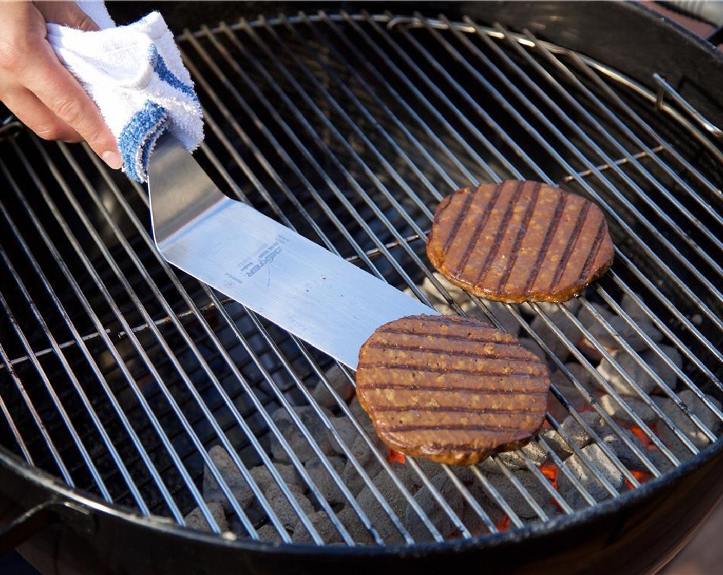 step 5 Place the Vegan Burger Patties (2) on the grill and cook for 5 minutes on each side.