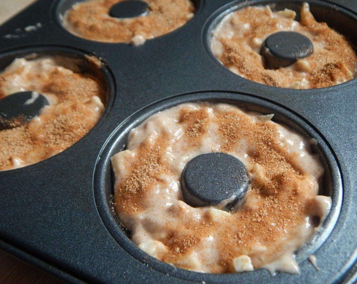 step 4 Divide into your donut pan. Mix the Granulated Sugar (1 tsp) and Ground Cinnamon (1/2 tsp) in a small bag, sprinkle on the donuts.