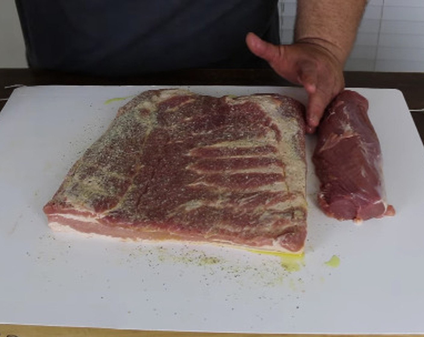 step 3 After the soak, take the pork belly and tenderloin out of the solution and season both with All-Purpose Spice Rub (to taste).