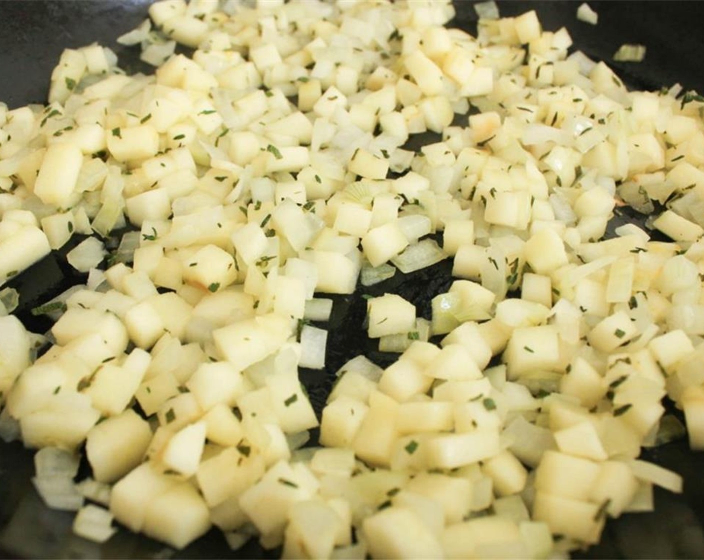 step 4 Heat Extra-Virgin Olive Oil (1 Tbsp) over medium heat. When hot, Yellow Onion (1/2), Apple (1), Fresh Sage (1 Tbsp), Fresh Thyme (1/2 Tbsp), and Kosher Salt (1/2 tsp). Cook for 5-6 minutes.