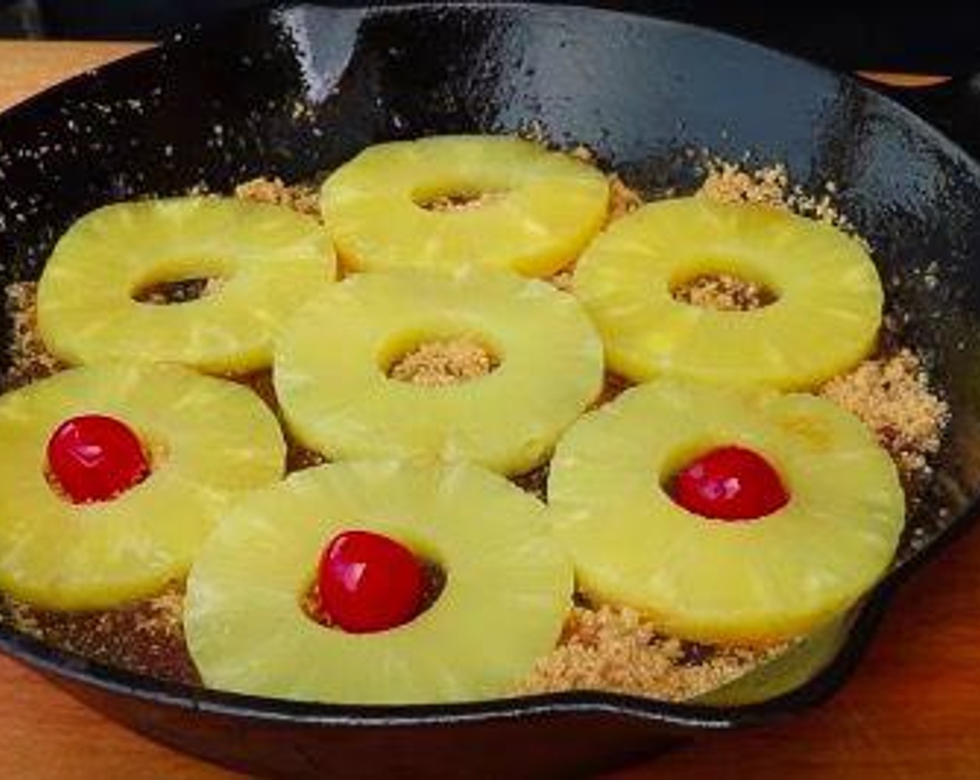 step 3 Arrange Pineapple Slices in Juice (1 can) in a single layer and place Maraschino Cherry (1 jar) in the center of each ring.