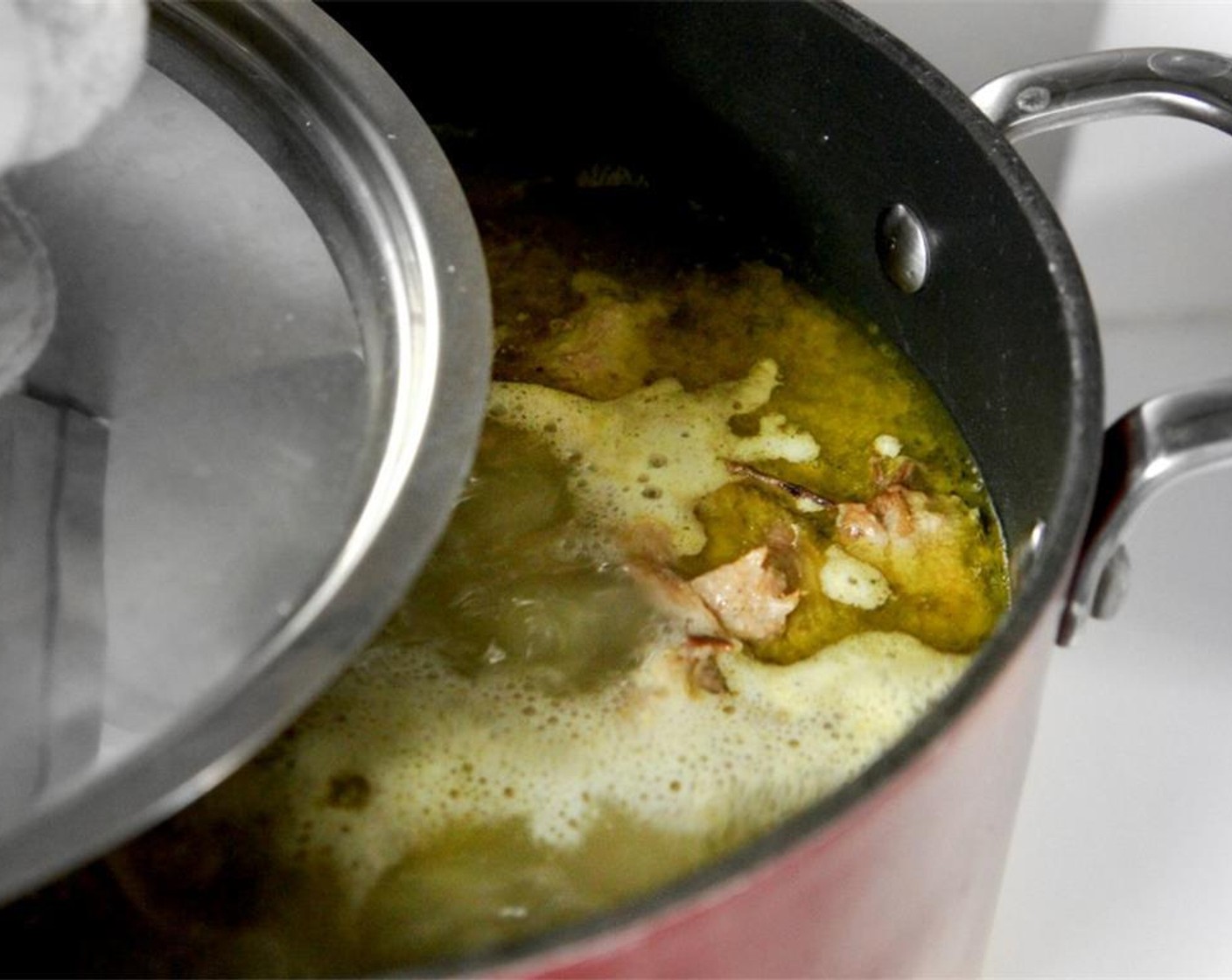 step 9 Partially cover the pot by half, and turn the heat to medium. Keep it at a medium-to-high-boil. Add more water along the way to keep the water level to its original amount until the liquid becomes milky, dense and opaque, about 2 hours.