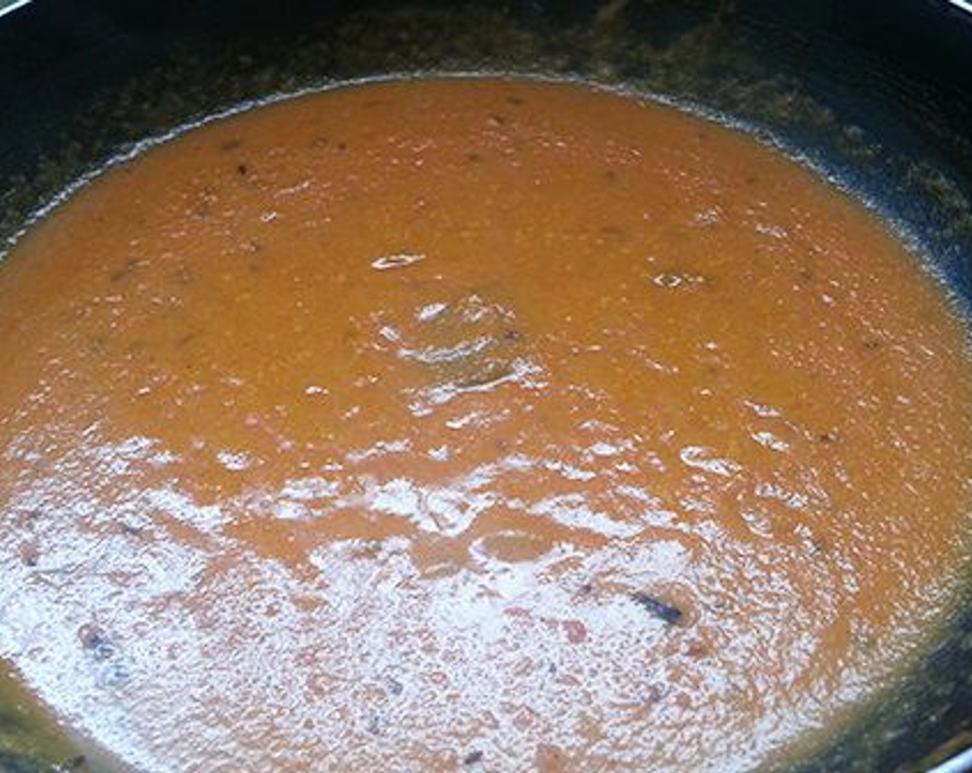 step 8 Saute in low flame till oil start to leave the sides of the pan. Add tomato puree. Mix well and let it boil. Add required water and let it boil.