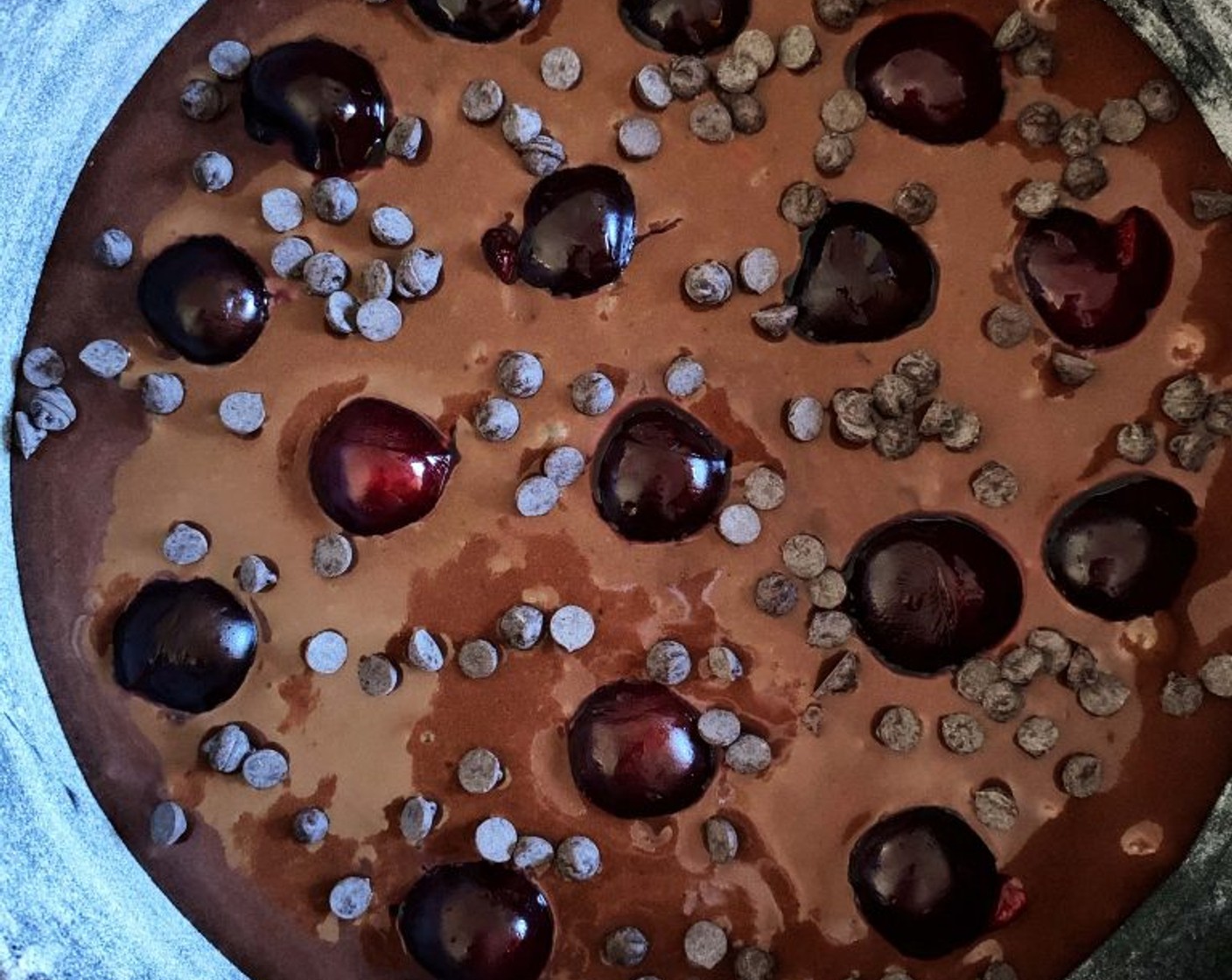 step 6 Oil and dust with flour an 18-centimeter cake pan, pour in the batter, and decorate the top with the remaining Cherry (1/2 cup) and all of the Dark Chocolate Chips (1/4 cup).