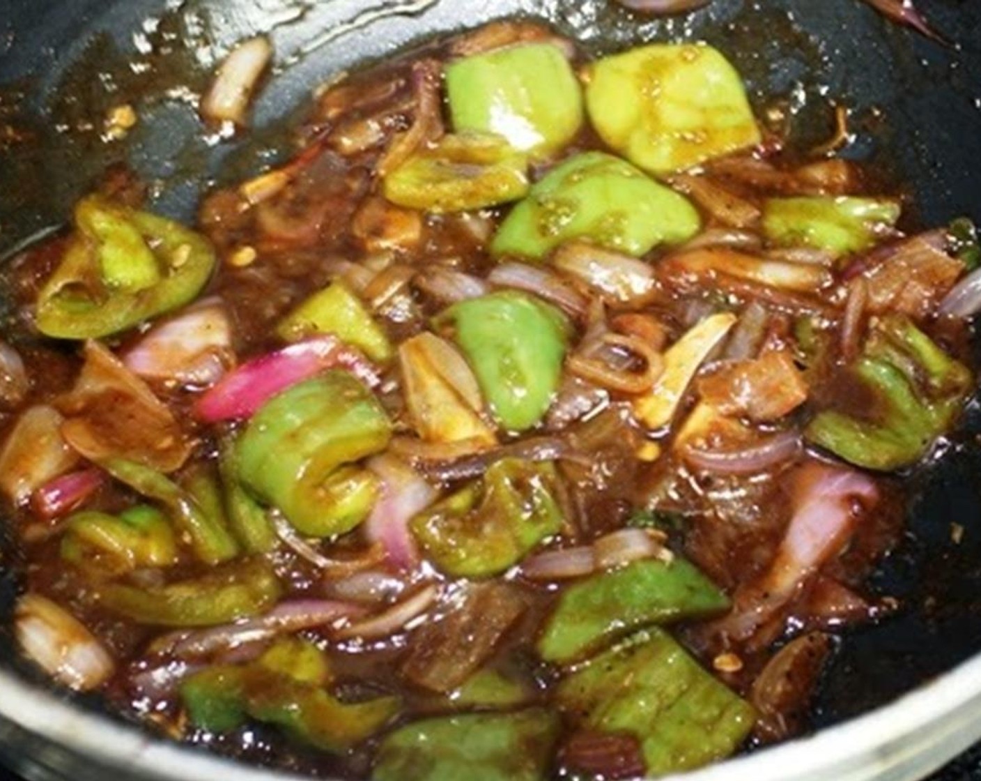 step 12 Add the fried paneer pieces to the mixture. Mix well without breaking up the paneer pieces.