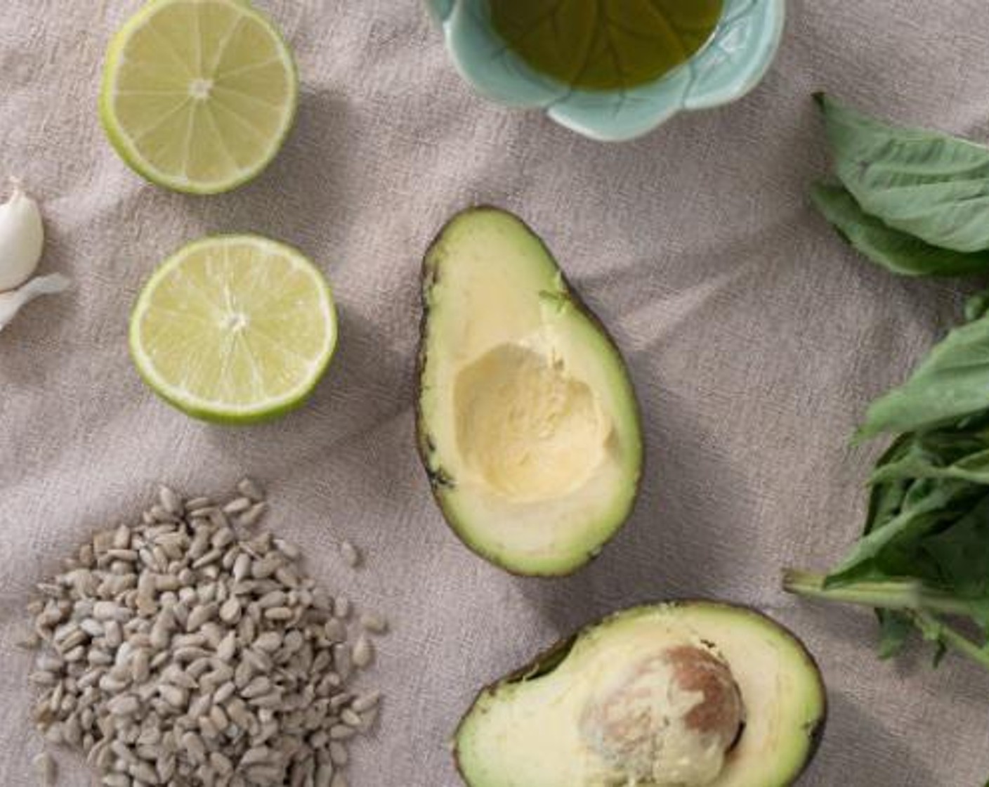 step 2 Using a food processor, add the Avocado (1), Garlic (1 clove), Fresh Basil (1/2 cup), Sunflower Seeds (1/4 cup), juice from Limes (2), Extra-Virgin Olive Oil (1/2 cup), Sea Salt (to taste) and Ground Black Pepper (to taste). Blend until creamy.