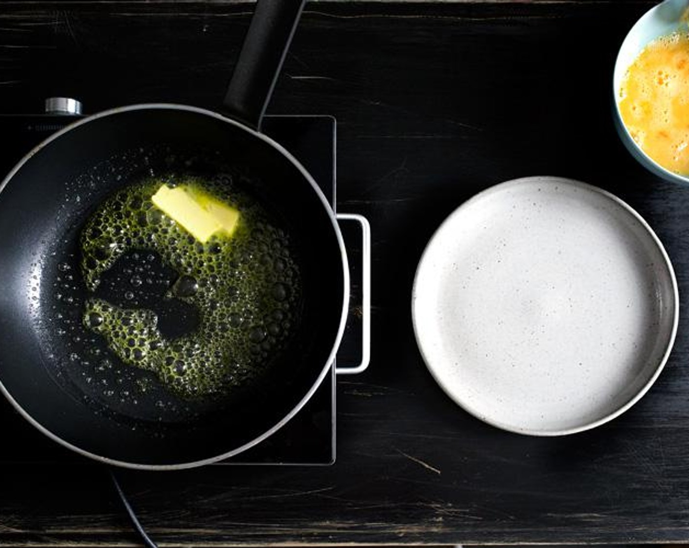 step 4 Heat a non-stick skillet over high heat until hot, then add the Unsalted Butter (3 Tbsp) (should sizzle right away).  Wait until the butter’s melted and bubbly, but before it browns…