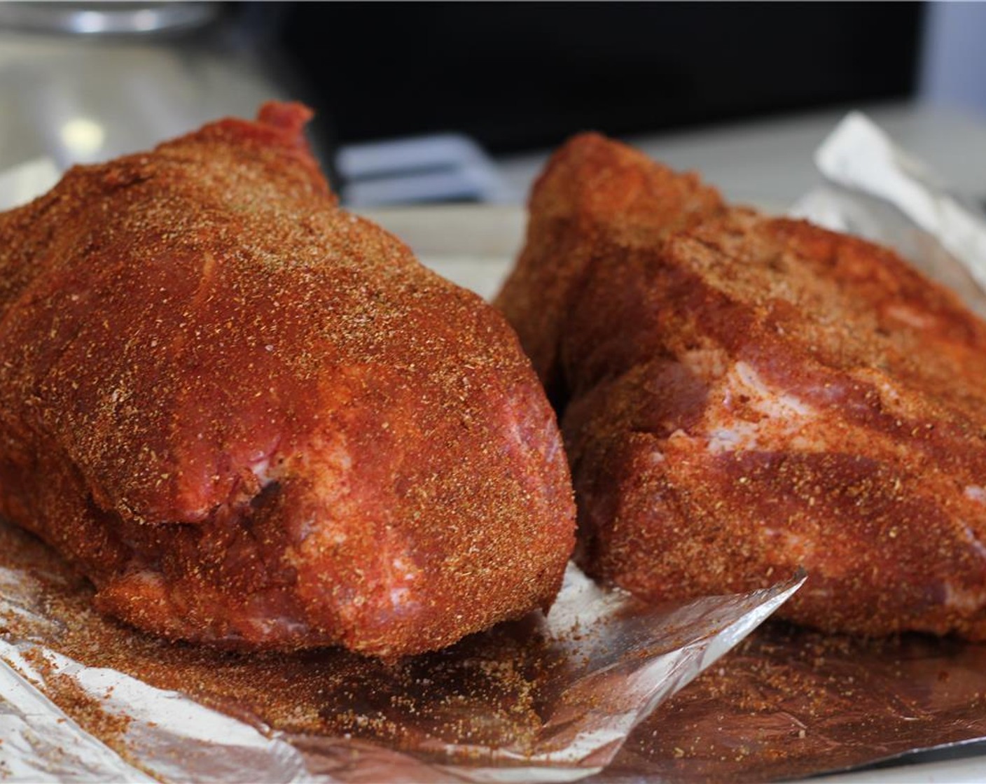 step 2 Pat the Pork Shoulder (4 lb) dry with paper towels and trim the excess fat. Cut into two chunks. Using your fingers, generously rub the spices into the pork on all sides.