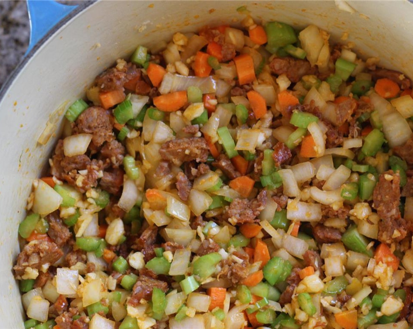 step 4 When 75 percent is cooked, add the onions, carrot, celery and garlic and sweat for 8 minutes.
