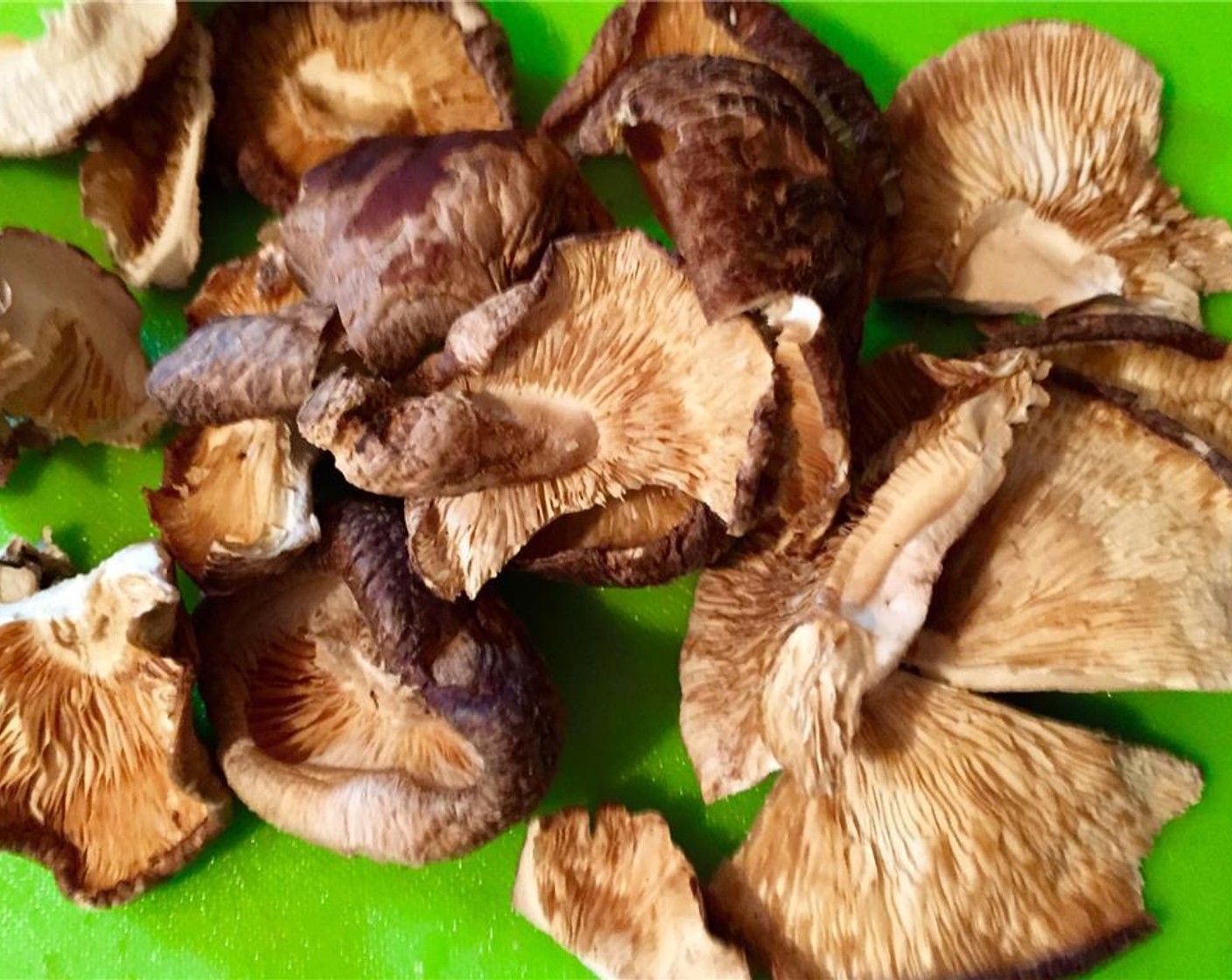 step 4 Break the Dried Shiitake Mushrooms (6) into three or four pieces. Discard stems.