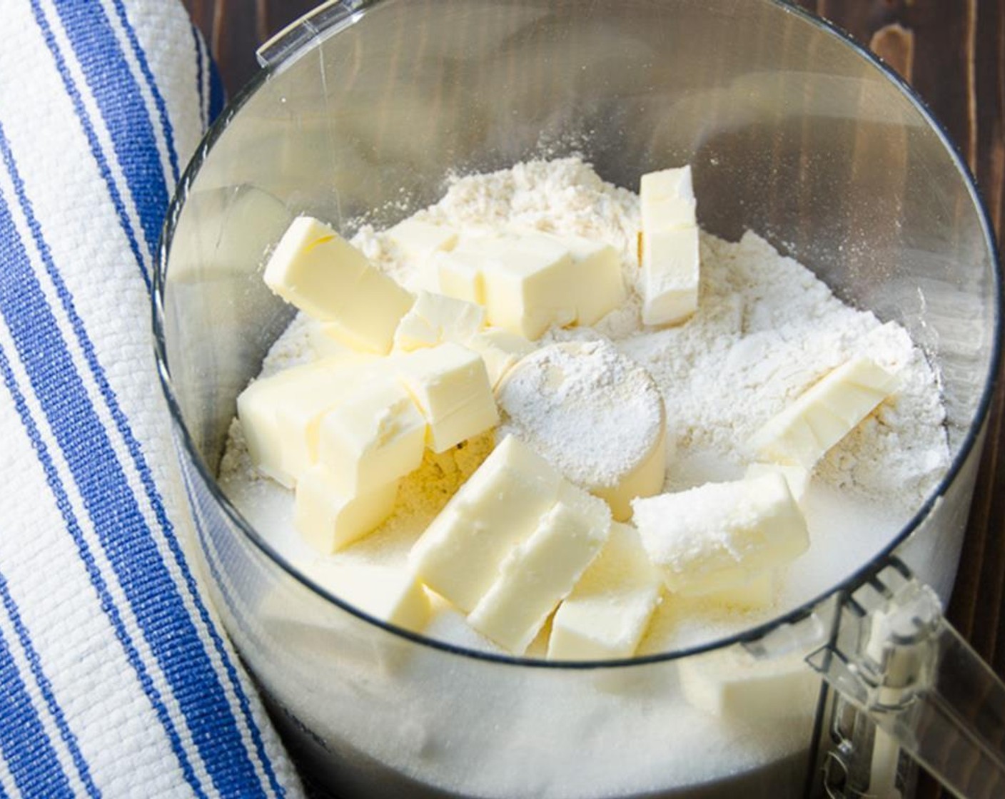 step 2 Place the All-Purpose Flour (1/3 cup), Granulated Sugar (1/2 cup), Ground Ginger (1/4 tsp), and Unsalted Butter (1/4 cup) into the bowl of a food processor and pulse until mixture resembles coarse meal.