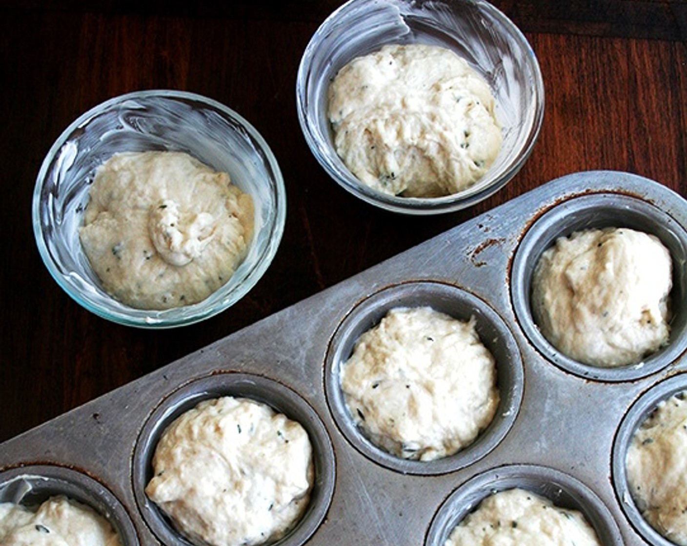 step 7 Let the dough rise for about 17 to 20 minutes or until it has risen to just above the top of the muffin cups.