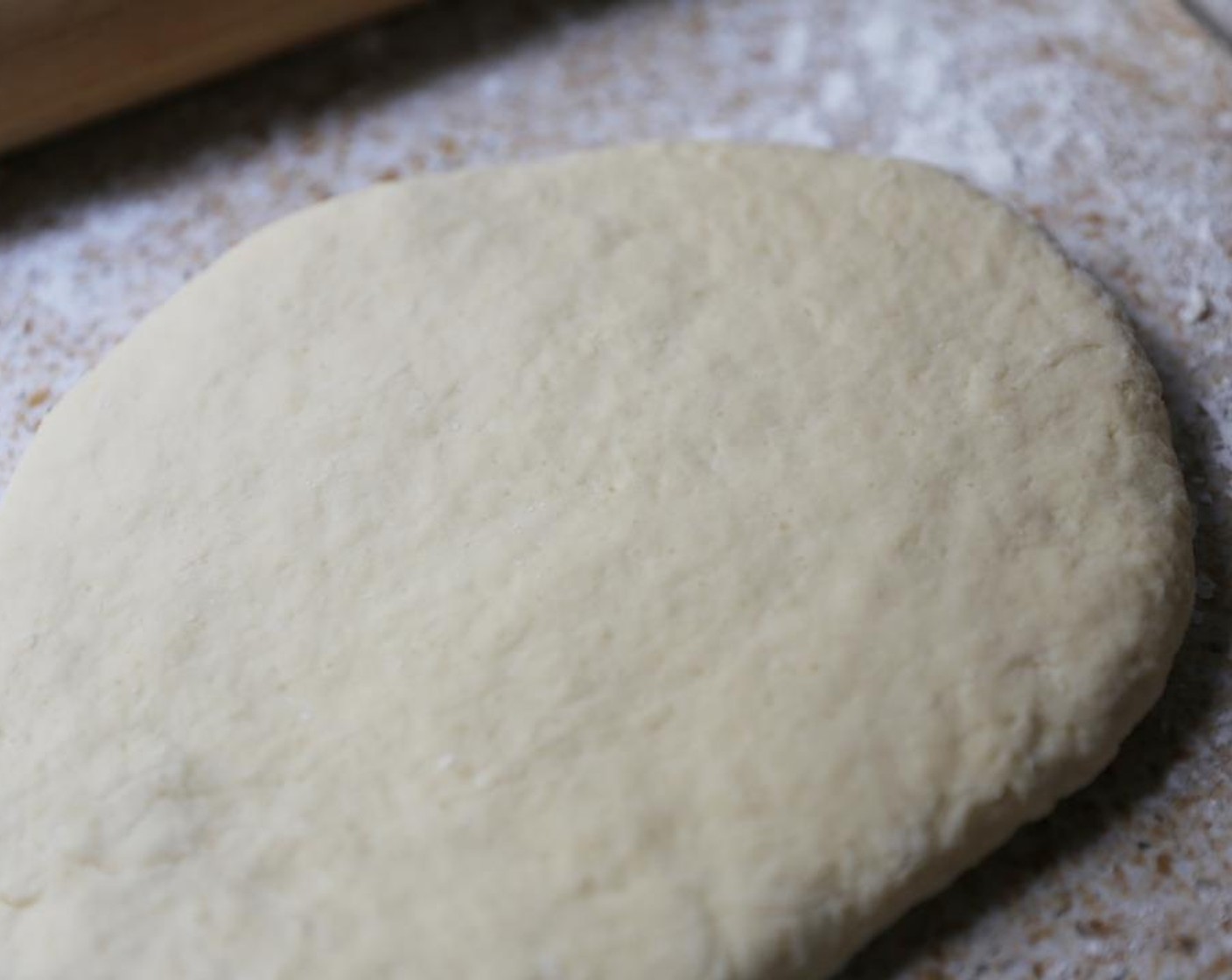 step 6 Transfer the dough on to a well floured surface and knead until smooth. Roll out to a 1-inch thickness.