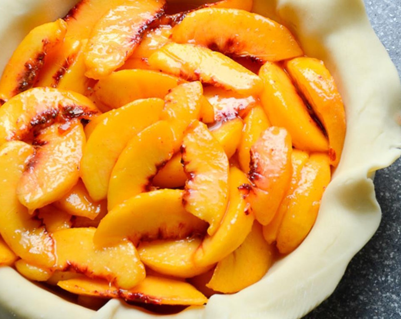 step 8 Spread peaches into the pie crust.