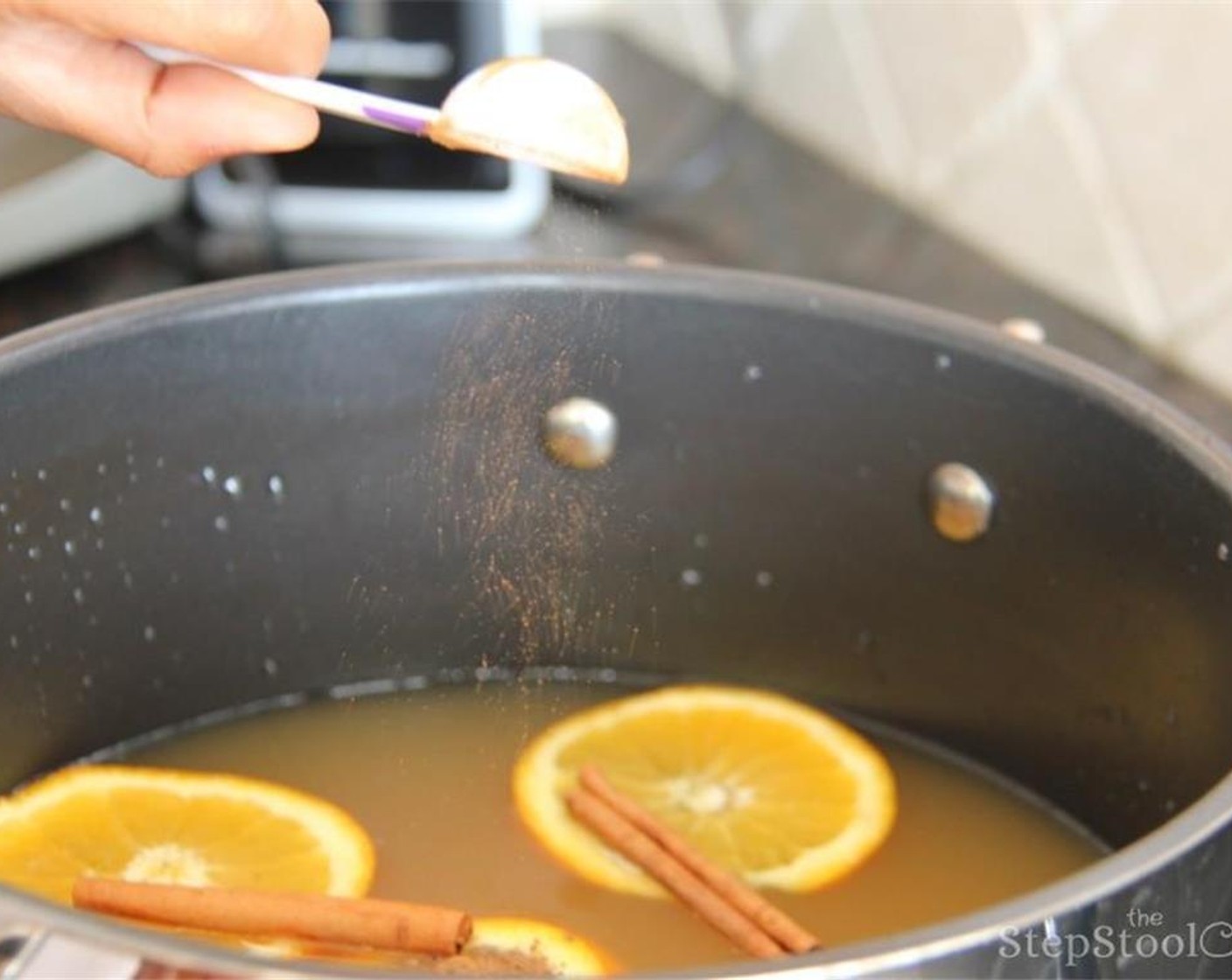 step 3 Add Cinnamon Sticks (5), Ground Cinnamon (2 Tbsp), and Ground Nutmeg (1/8 tsp) into the pot. Mix and let simmer over medium heat for 10 minutes.