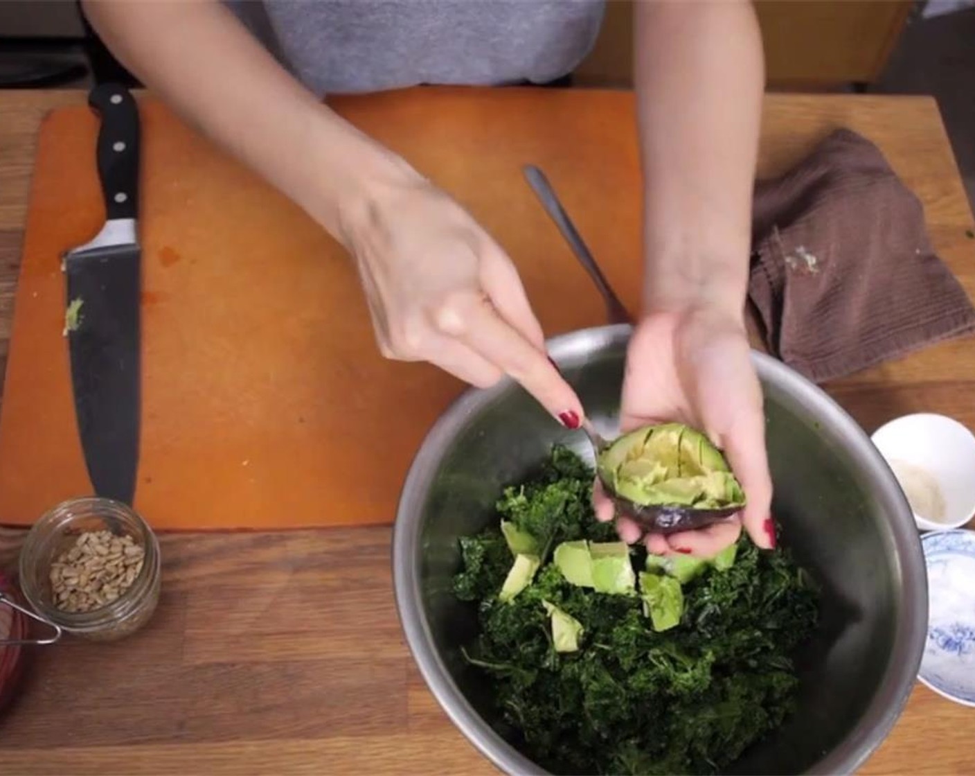 step 2 Halve, pit, then dice, and scoop out the Avocado (1) into the bowl. Top with some Pickled Red Onions (1/4 cup) and Sunflower Seeds (to taste).