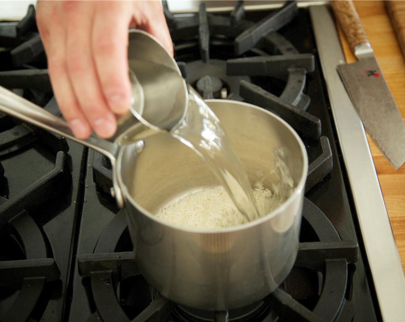 step 5 In a small saucepan, add Jasmine Rice (2/3 cup) with one cup of cold water. Bring to boil, cover and reduce heat to simmer. Simmer for 15 minutes.