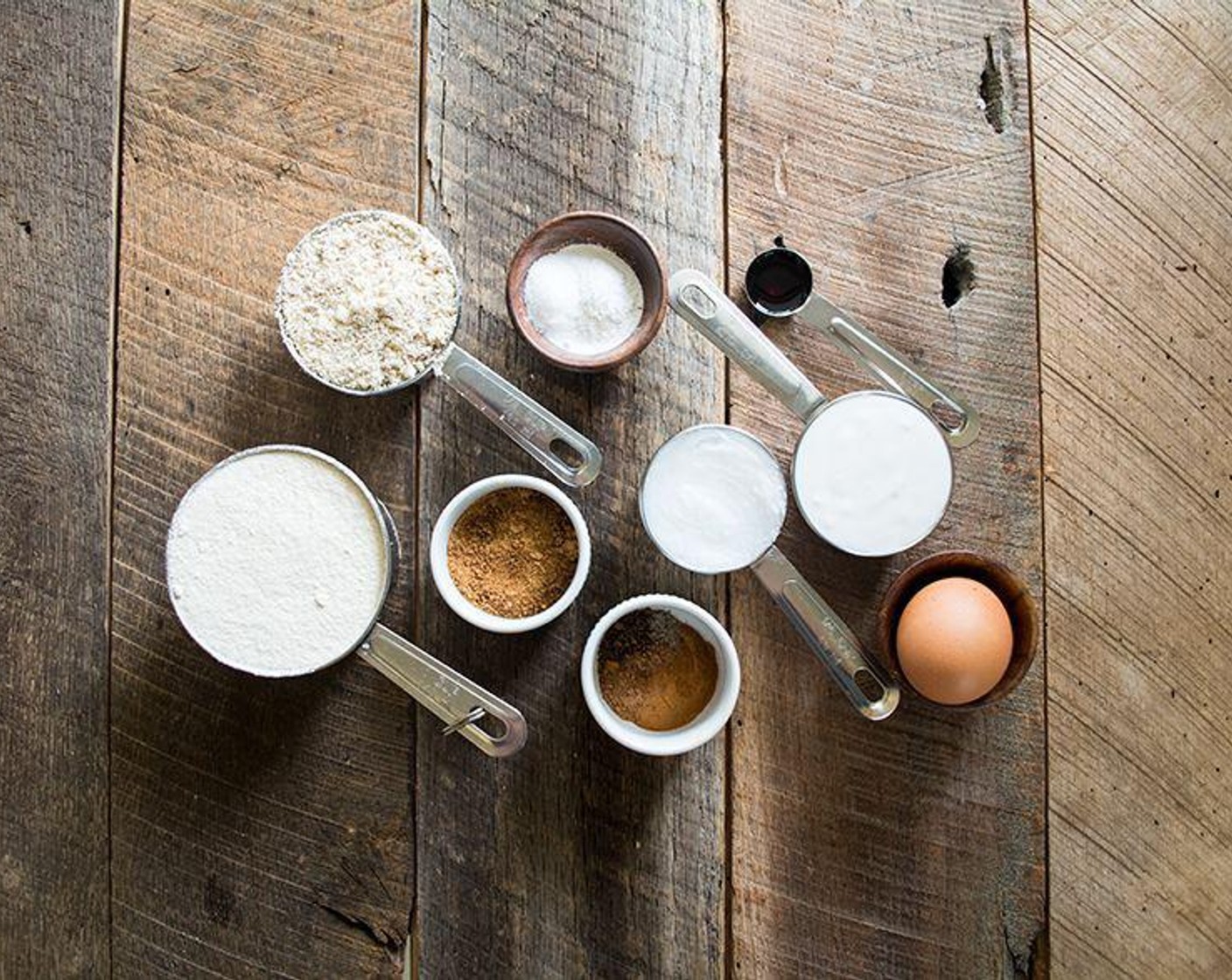 step 2 In a large mixing bowl, whisk together Whole Wheat Flour (1 3/4 cups), Coconut Sugar (2 Tbsp), Baking Powder (1/2 Tbsp), Ground Cinnamon (1 tsp), Ground Nutmeg (1/2 tsp), Freshly Ground Black Pepper (1 pinch), and Salt (1/2 tsp).