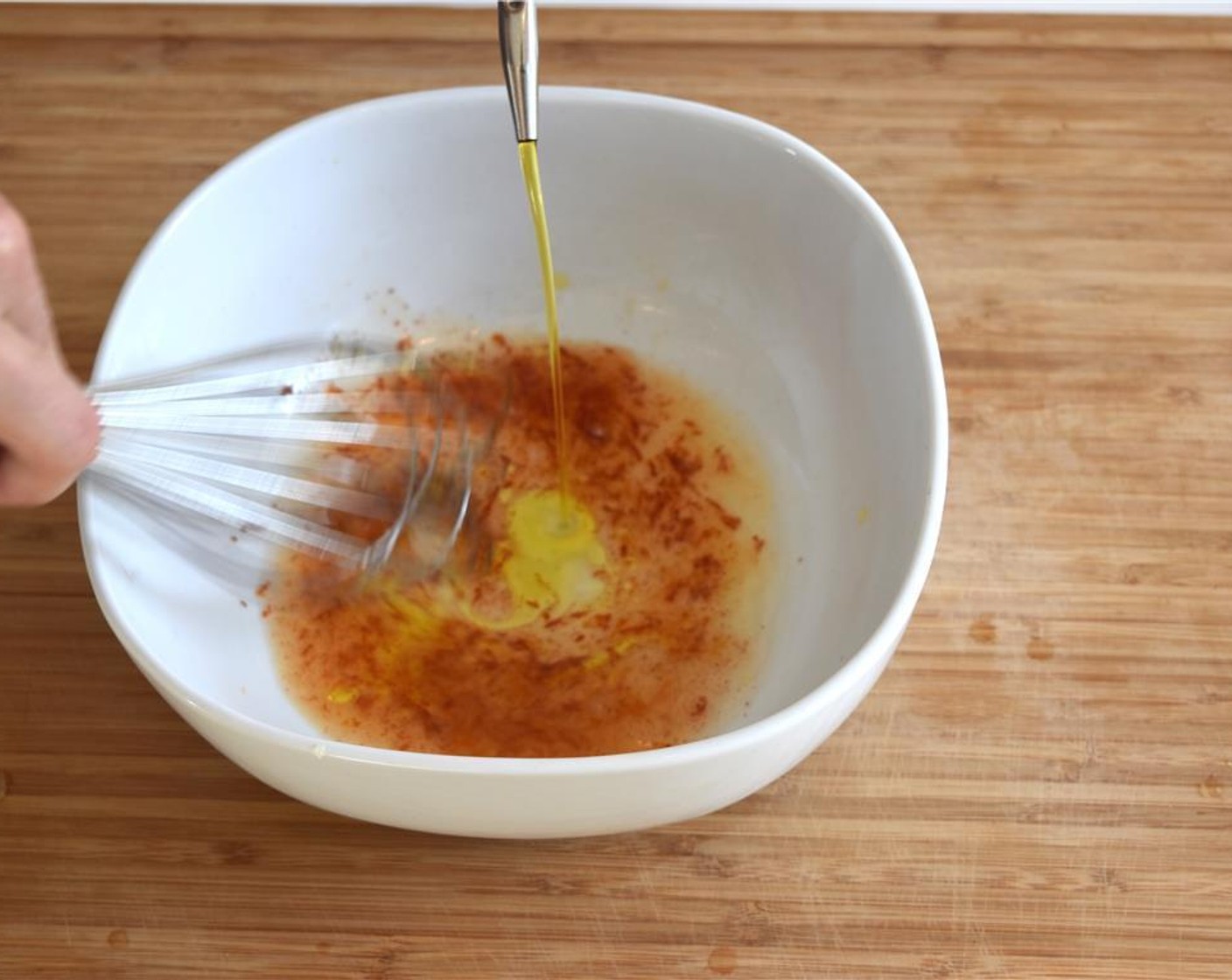 step 2 Add Chili Powder (1/2 tsp) and Honey (1 tsp), then stream with Olive Oil (1/2 cup) whisking constantly, until emulsified. Add Salt (to taste) and taste to check seasoning.