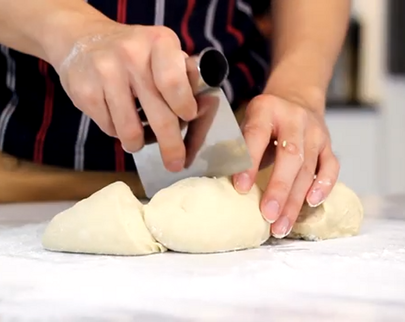 step 5 Remove the air from the dough on a dusted surface and shape it into a disk. Divide it into 4 pieces.