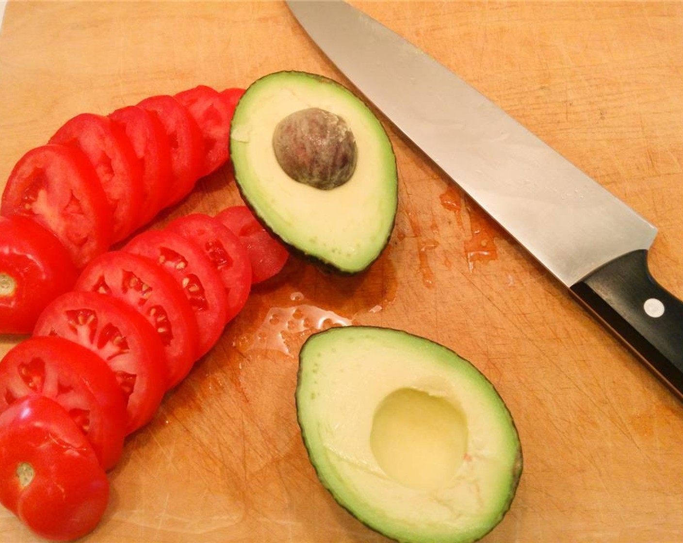 step 1 Slice the Roma Tomatoes (4) into small cross-sections. Grip the Avocado (1) and slice it in half around the seed. Expose both halves and remove the seed. Use a knife to cut each half into smaller long slices, peeling off the skin as you go.