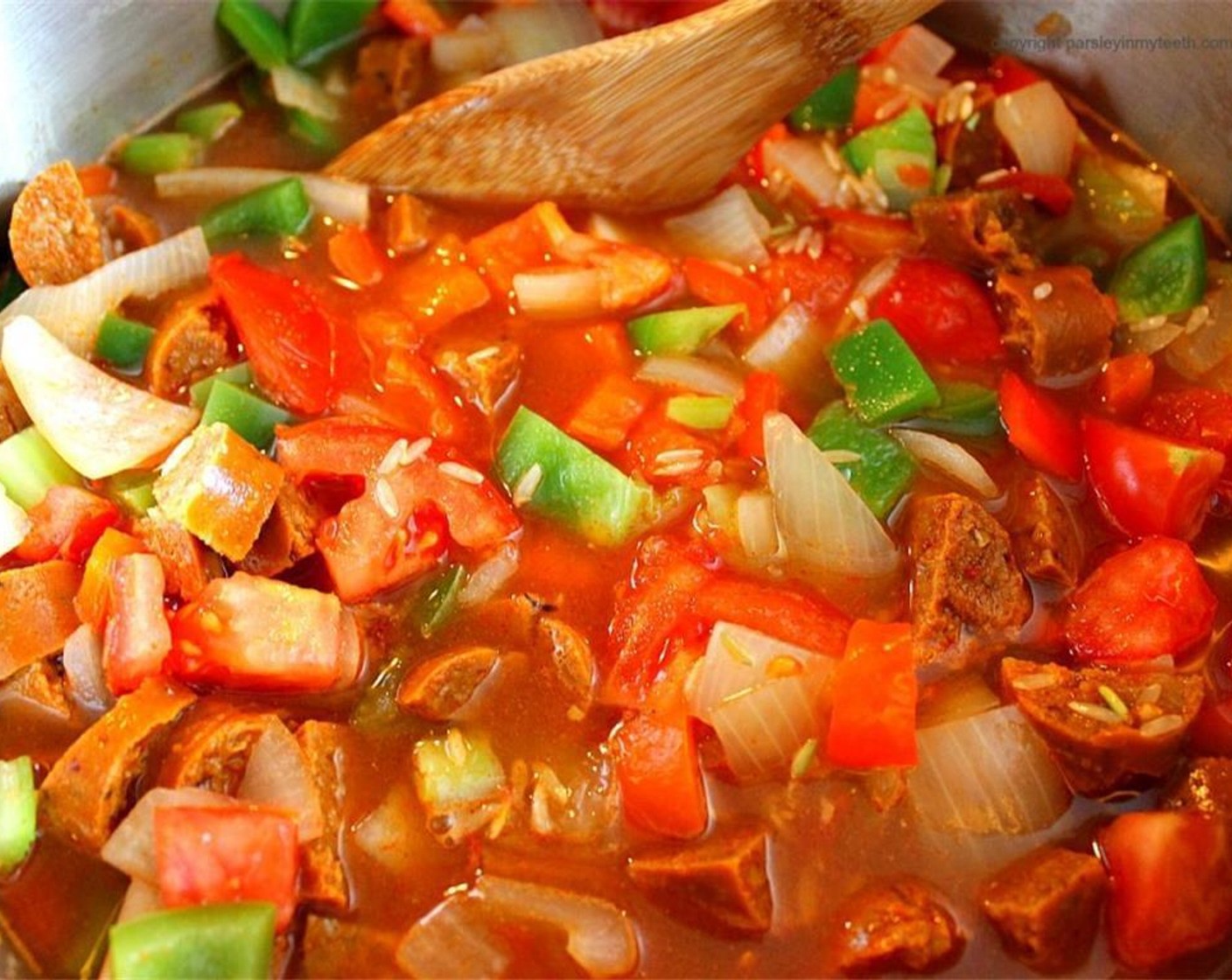 step 4 Add spicy hot vegan sausages, Cayenne Pepper (1 tsp), Freshly Ground Black Pepper (1/2 tsp), Brown Rice (1 cup), and Vegetable Broth (2 cups). Mix well and bring to a full boil.