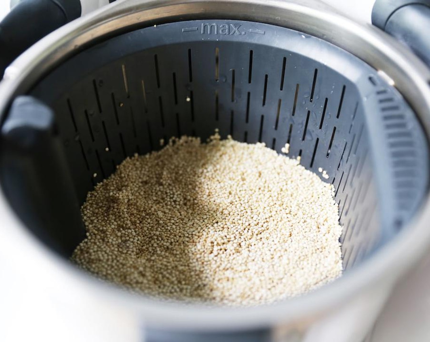 step 3 While the peppers are roasting, put Quinoa (3/4 cup) into the basket. Rinse quinoa with water.