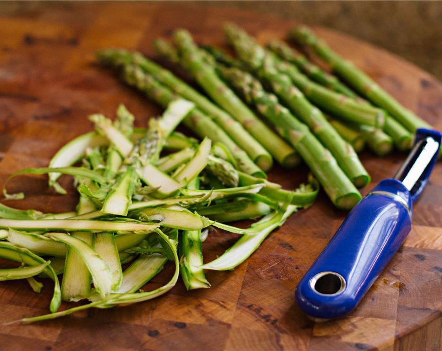 step 4 Clean and trim the Asparagus (1 2/3 cups) by removing the tough lower ends. Use a vegetable peeler to shave the asparagus into ribbons.