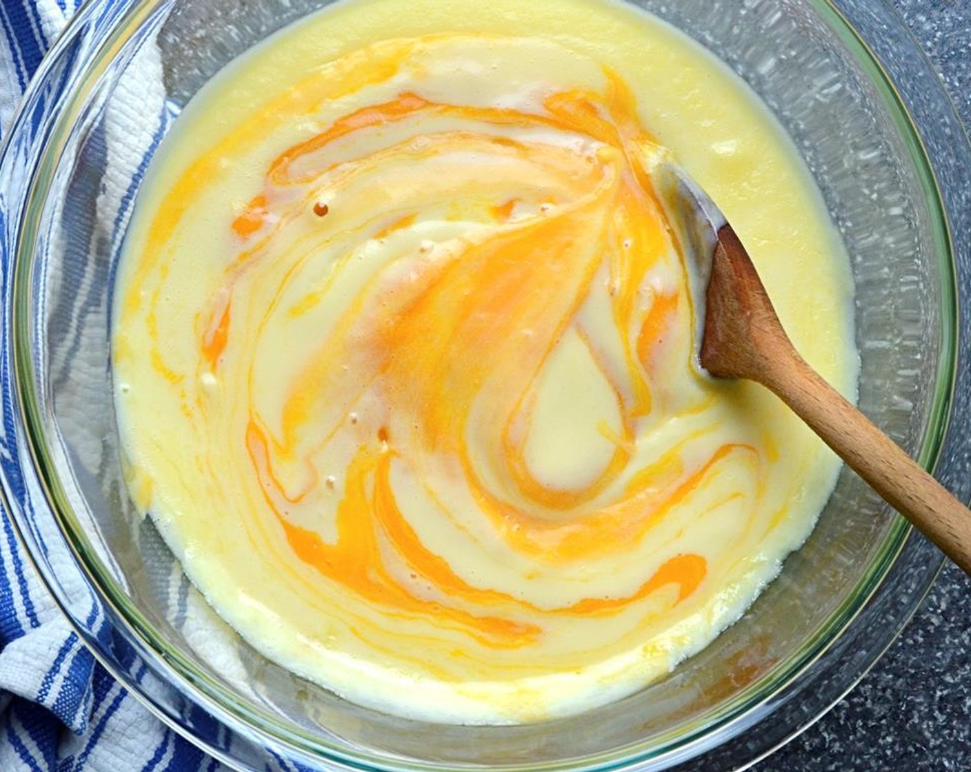 step 9 Stir in the Coconut Extract (1/2 tsp). Add the mango puree and stir to combine. Cover the custard with plastic wrap and refrigerate until very cold or overnight.