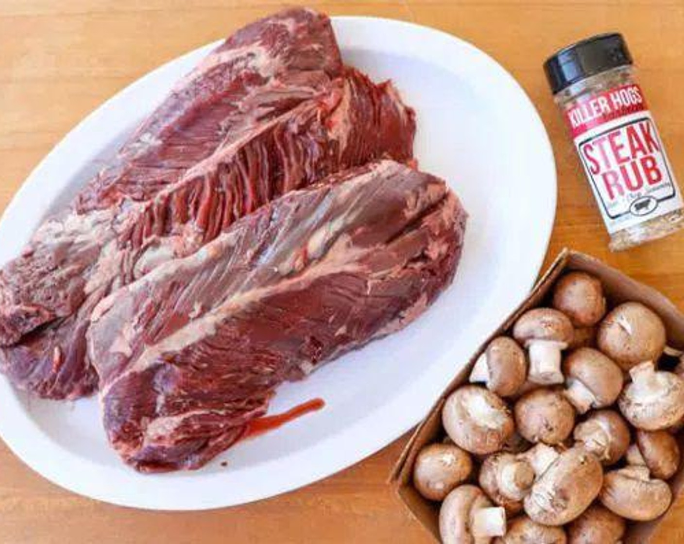 step 2 Remove the connective tissue between each section of Hanger Steak (2), splitting it into two pieces. Trim away any excessive silver skin or fat.