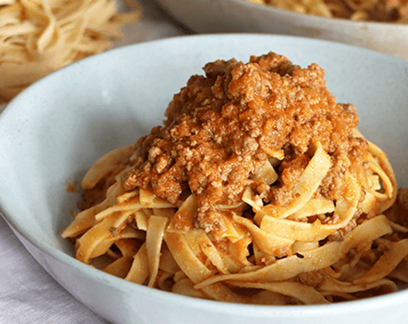 step 16 Serve the Bolognese sauce pasta can be served on a plate or in a bowl – either way, you’ll likely add some extra sauce! You can also add a sprinkle of Parmigiano or Pecorino cheese to the top for some added salty goodness.