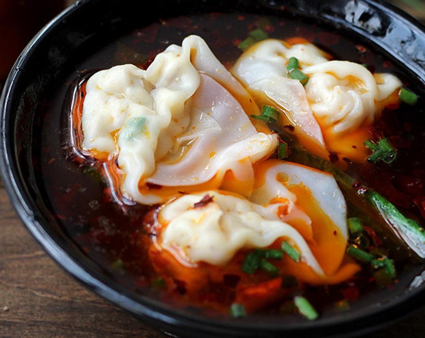 step 7 Scoop around 1/2 bowl of the bowling water into the serving bowl (or you can use stock). Then place wontons in too. Serve hot.