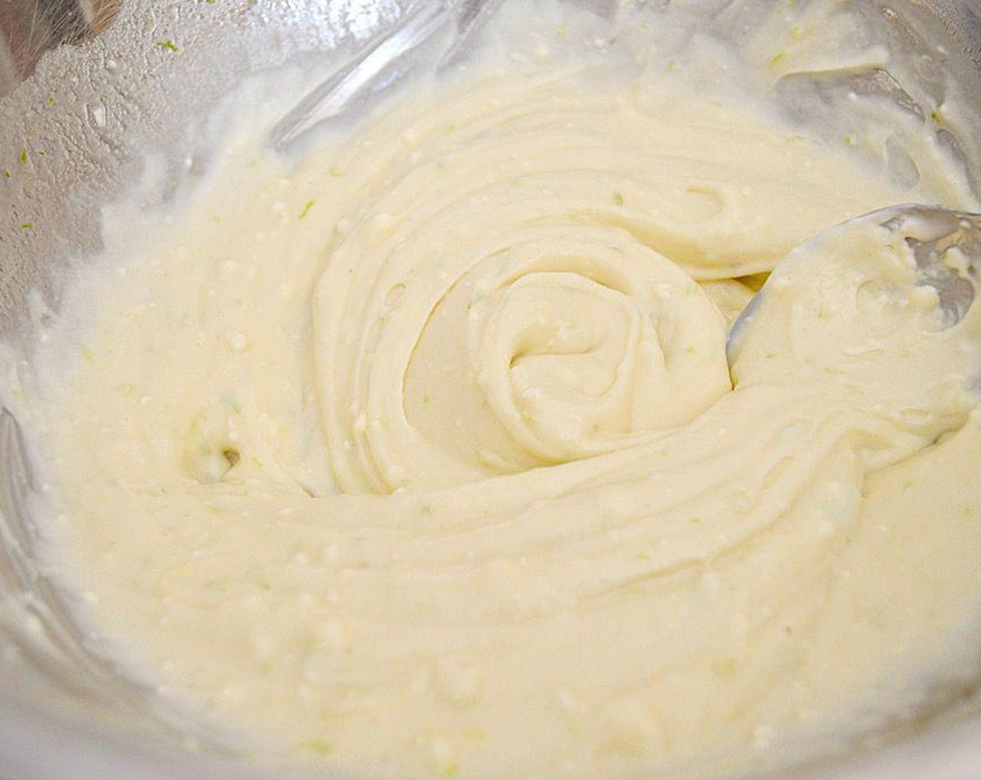 step 4 While it freezes, make the filling. Stir the Cream Cheese (2 cups), Tequila (3 Tbsp), Limes (2), Granulated Sugar (1 cup), Sea Salt (1 tsp) and Vanilla Extract (1/2 tsp) together until smooth and luscious.
