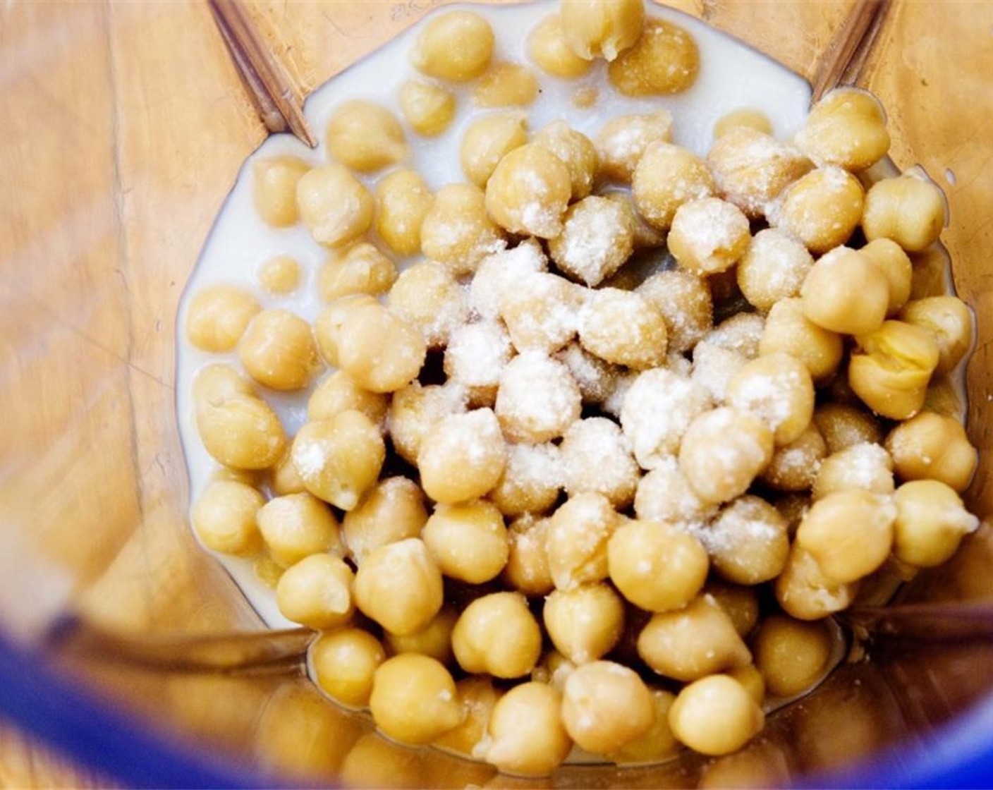 step 2 Wash and rinse the GOYA® Chick Peas (1 1/4 cups), then add them together with the Almond Milk (1/3 cup) to a blender or food processor.