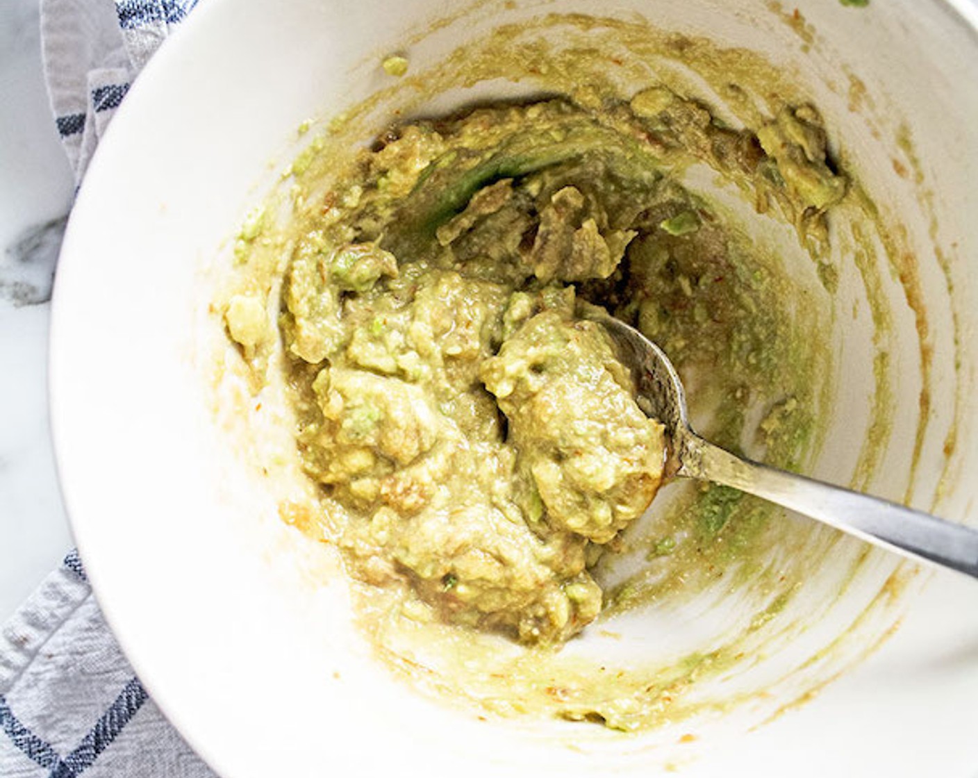 step 1 For the avocado mixture, add Avocado (1/2) to a small bowl along with Salsa (1 Tbsp), mash with the back of a fork until well combined, then set aside.