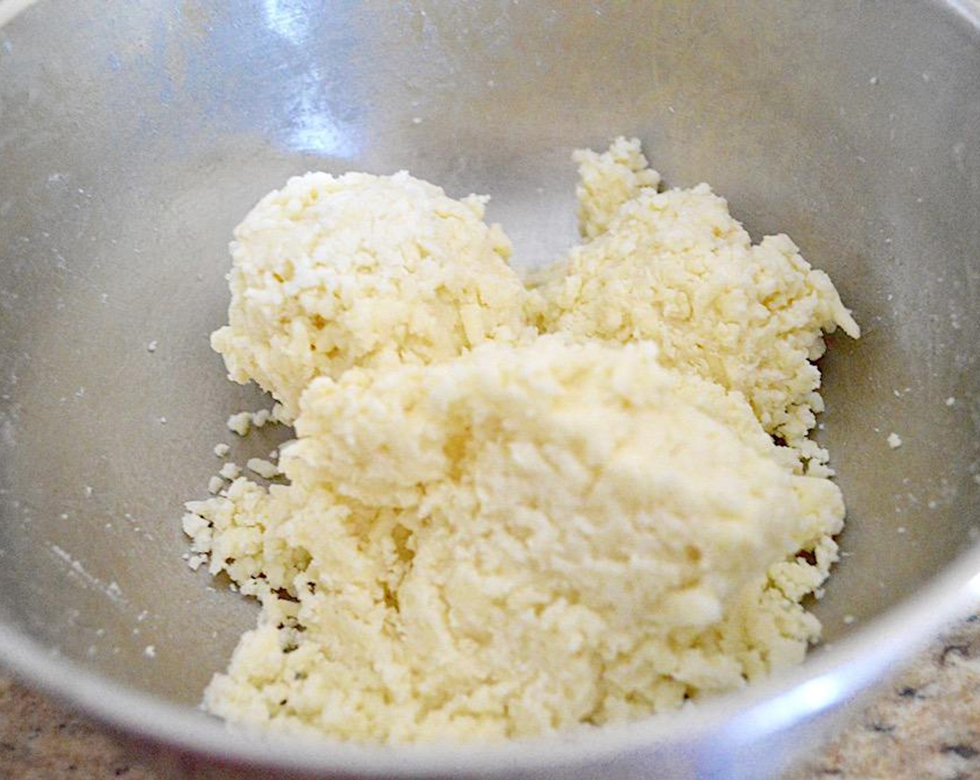 step 6 While it cooks, put together the cheese mixture. Stir Mozzarella Cheese (2 cups), Parmesan Cheese (1/2 cup), and Ricotta Cheese (1/2 cup) together well, then squeeze it together with clean hands into a fairly solid mixture.