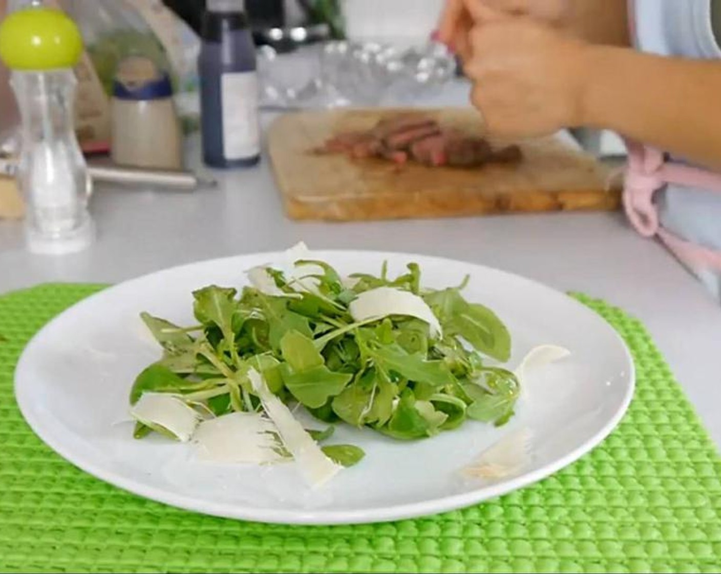 step 6 Using a vegetable peeler add some Parmesan Cheese (to taste) shavings and place the steak strips on top. Drizzle the Balsamic Glaze (to taste) over the plate and add more olive oil over the speak for extra flavour.