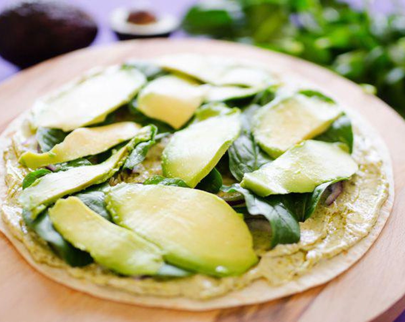 step 2 Sprinkle Red Onion (1/2 cup) and lay Fresh Spinach (1 handful) and Avocados (2) over the cream cheese, gently pressing the vegetables into the cream cheese.