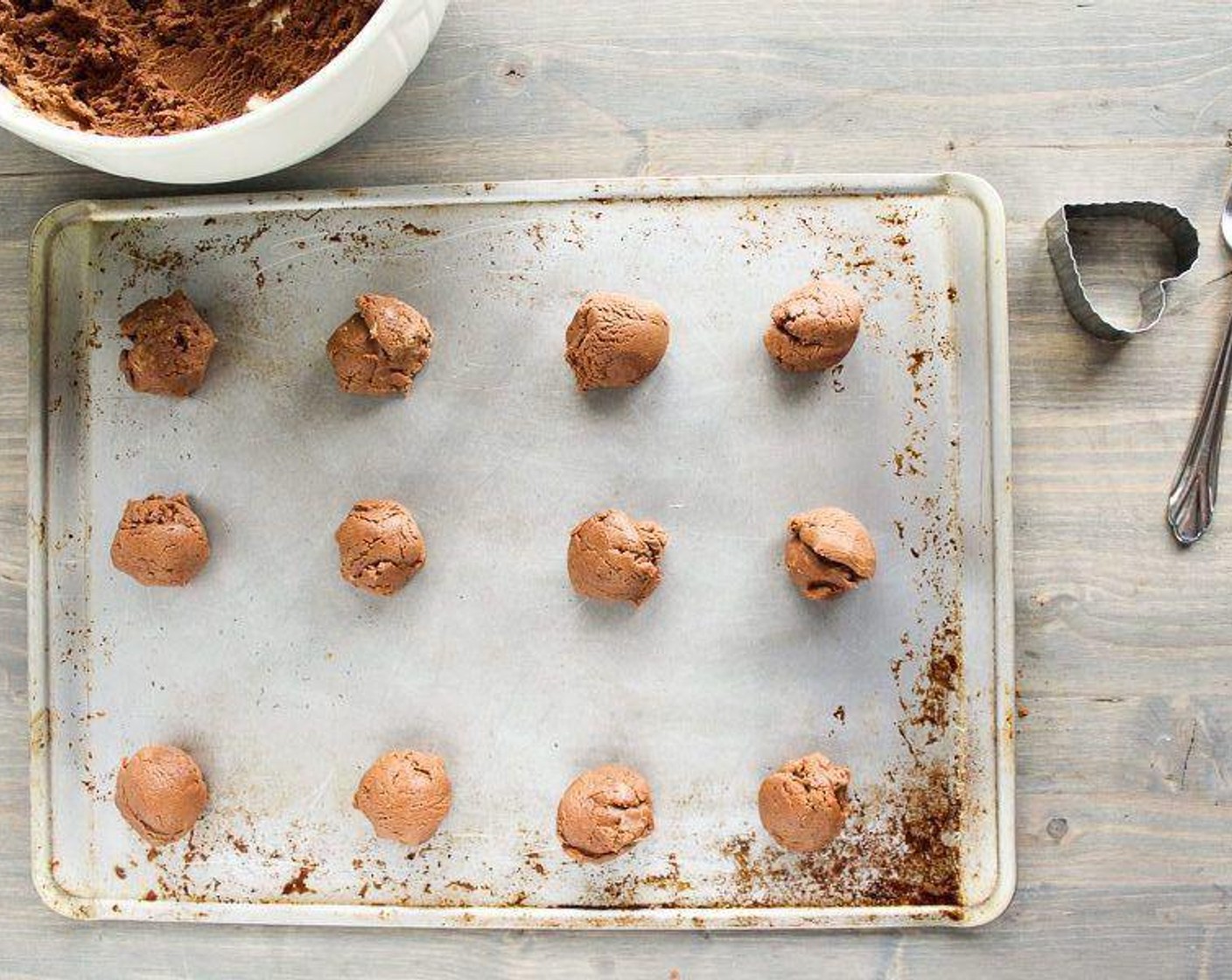 step 5 Using a tablespoon or teaspoon depending on how large you want your cookies, scoop out even sized amounts. Form into a ball and place onto a cookie sheet 1 1/2 inches apart.