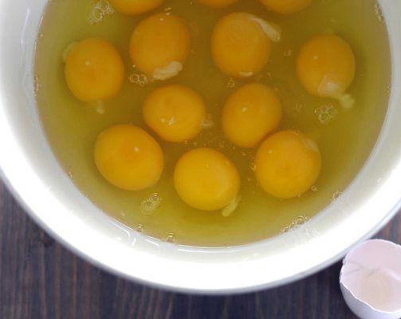 step 6 In a large bowl, whisk the Eggs (12) until they are light and fluffy. Quickly whisk in the All-Purpose Flour (1/2 cup), Baking Powder (1 tsp), Ground Black Pepper (1/2 tsp), and Salt (1/2 tsp).