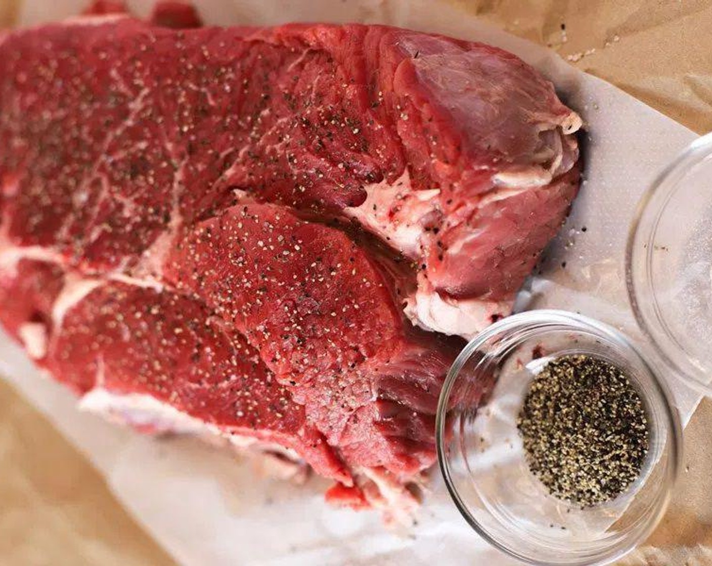 step 1 First, you can sear the Boneless Chuck Roast (3 lb) in a skillet. Heat a skillet at medium to medium-high heat. Add Extra-Virgin Olive Oil (2 Tbsp) to the pan. Season with Salt (to taste) and Ground Black Pepper (to taste) on both sides of the beef like you would a steak. Add beef chuck and sear on one side until decently brown. Flip on the opposite side and sear this side as well.