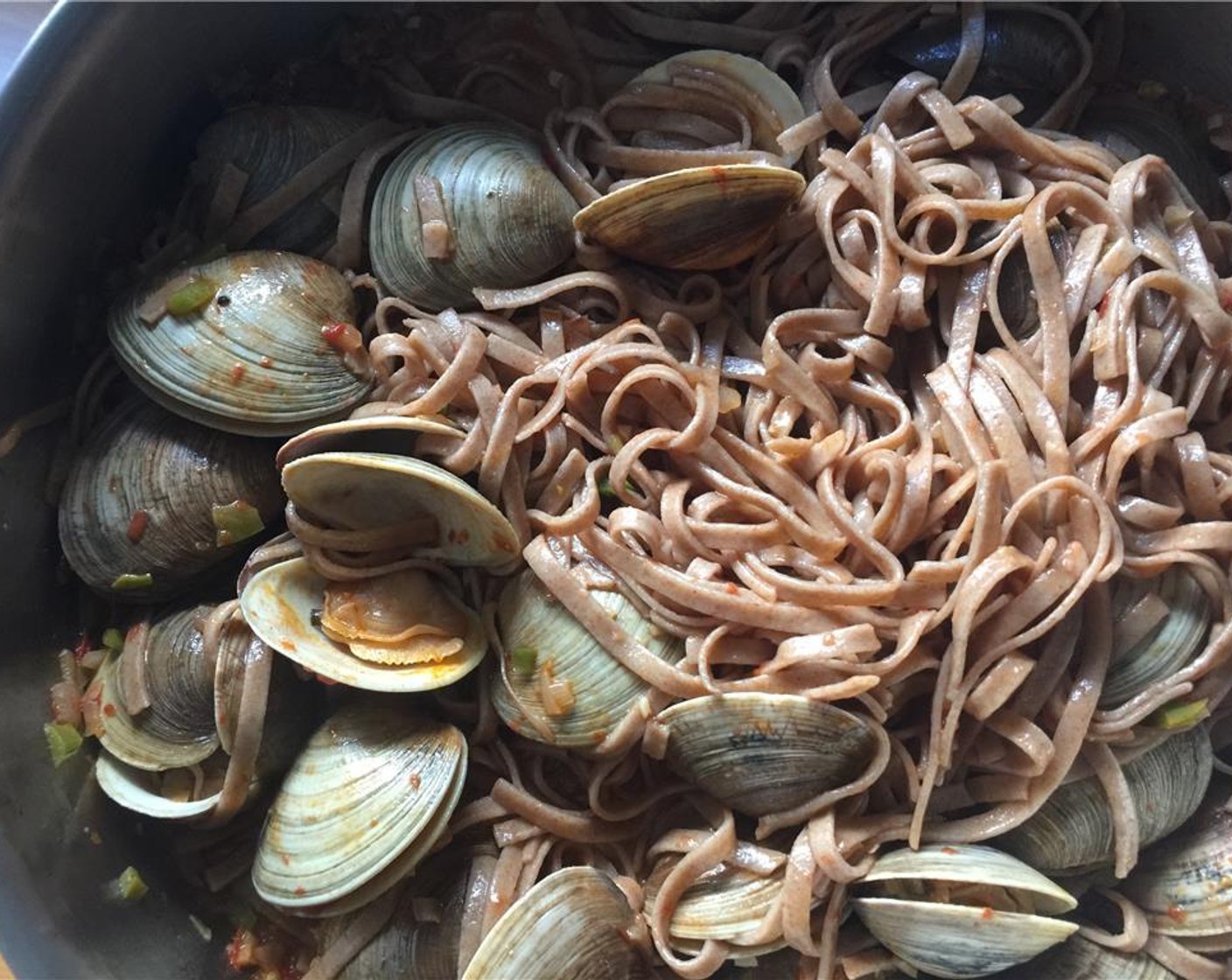 step 13 Add in the cooked linguine and toss with the clams.
