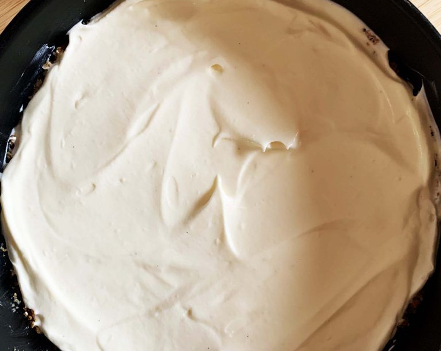 step 7 Pour in the mixture into the refrigerated base and level it out using the back of a spoon.