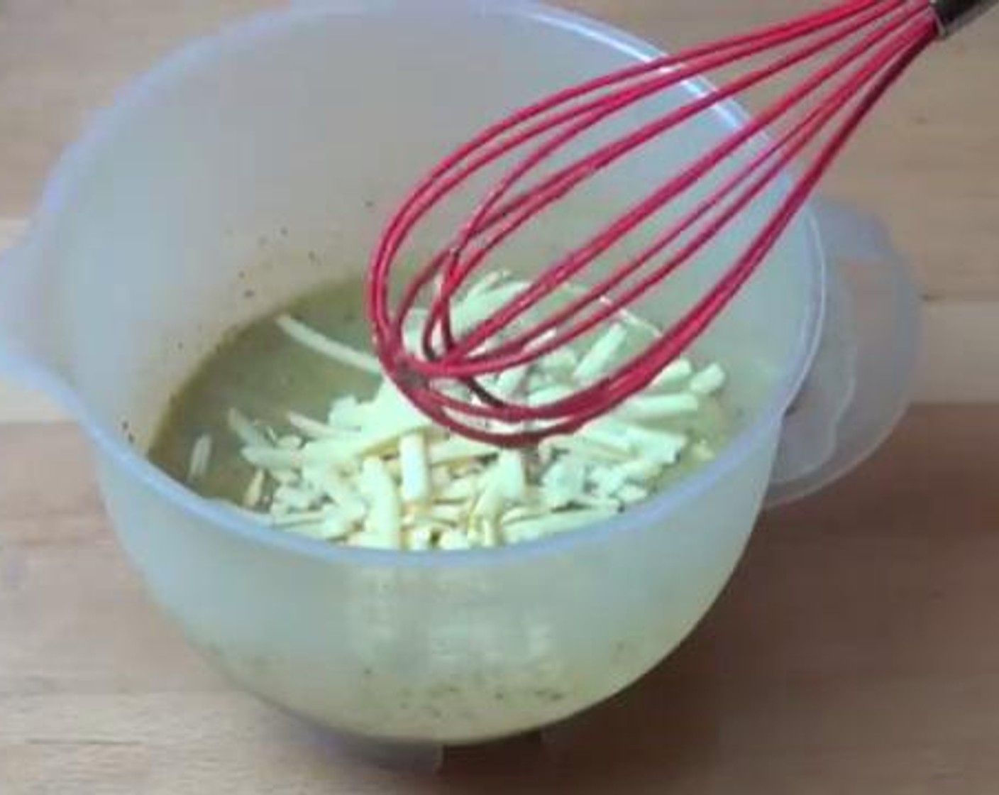 step 3 Beat your Eggland's Best Classic Eggs (5). Add the Basil Pesto (2/3 cup) and the Cheddar Cheese (1 cup) into the eggs and mix everything well. Season with some Salt (to taste) and Ground Black Pepper (to taste).