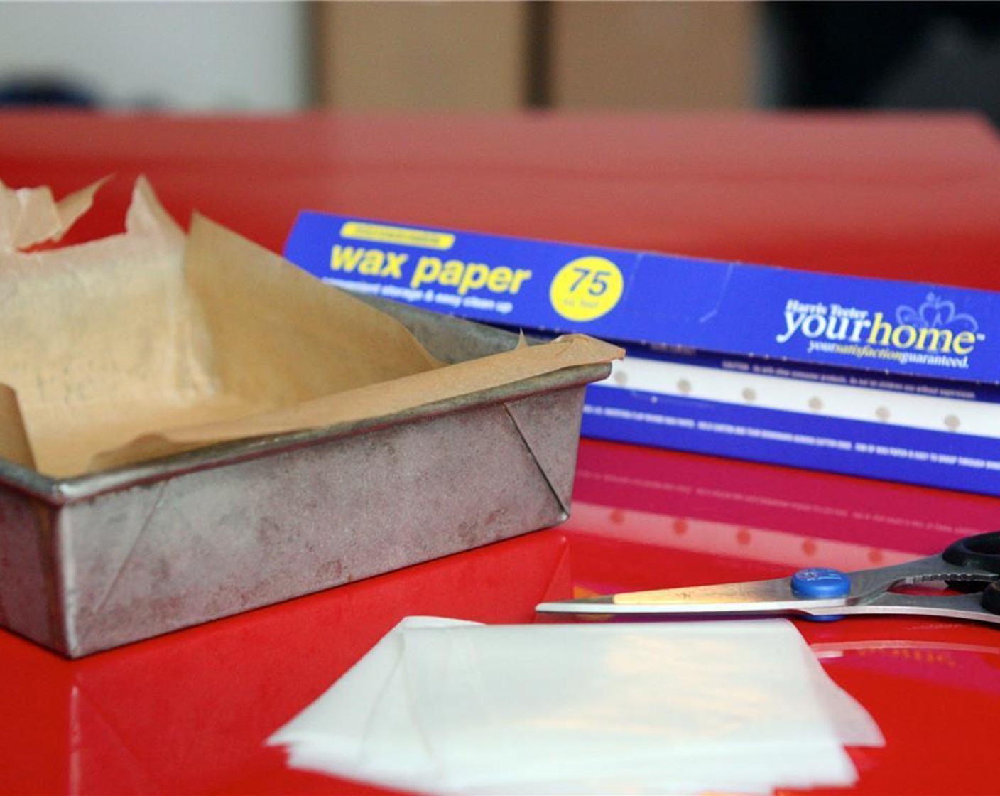 step 2 Use two strips of parchment paper to line an 8-inch square pan, crossing the parchment so that the bottom and all sides are covered. You can also use this time to cut wrappers out of wax paper, about 64 four-inch squares.